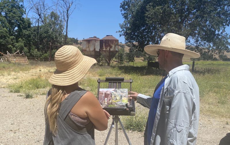 Artist and instructor Tim Horn works with a student 