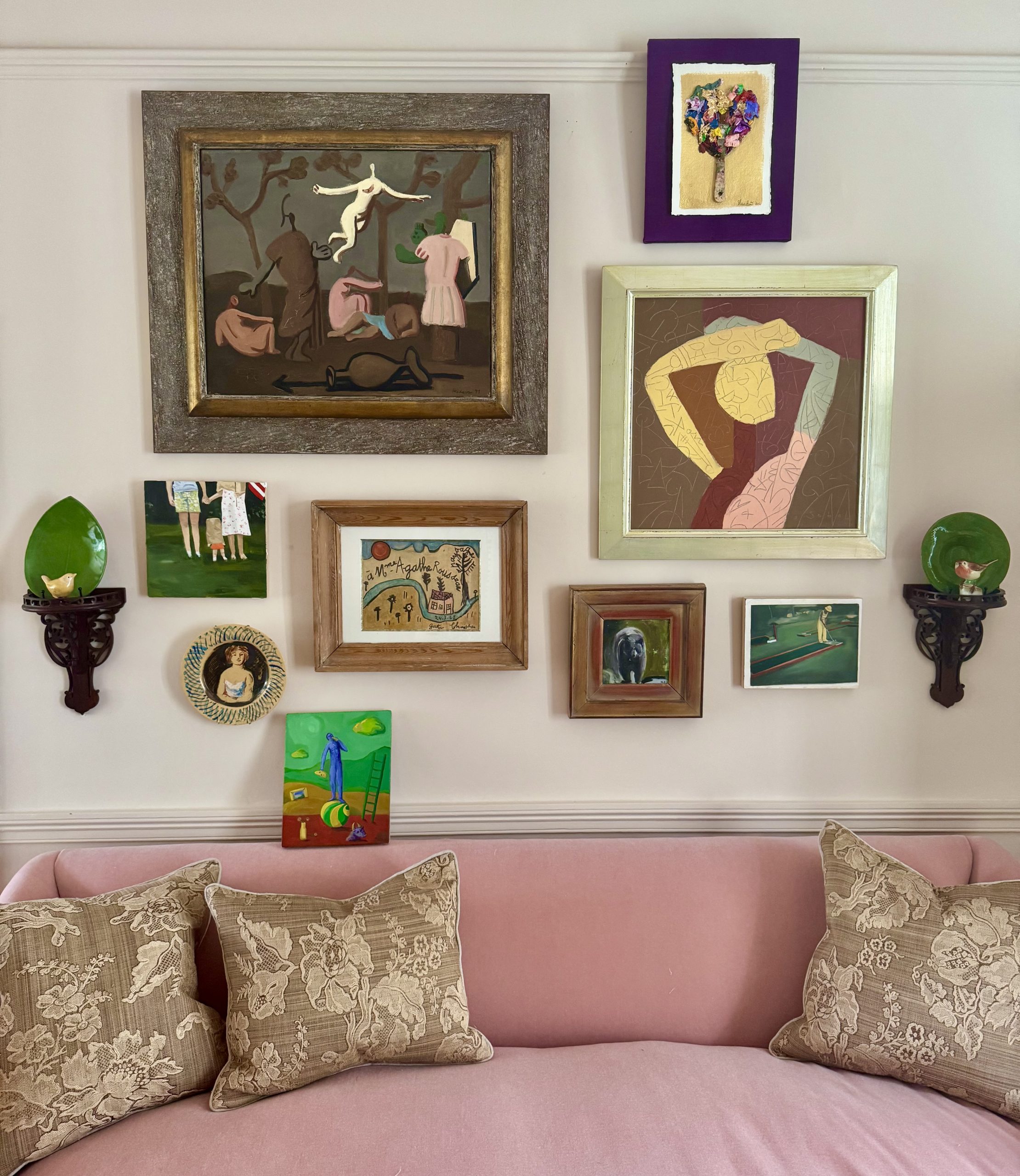 The drawing room at Lovedays House - sofa with art wall hung salon style. Rose Uniacke sofa. Adam Bray Designs